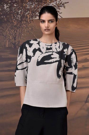 Beige top with tailored fit and abstract brushstroke sleeve detailing