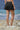 Black skirt for women with clean waistband and minimal detailing