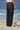 Black trousers for men with clean waistband and minimal detailing