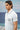 Blue poly viscose lycra t-shirt for men showing smooth stretch fabric texture