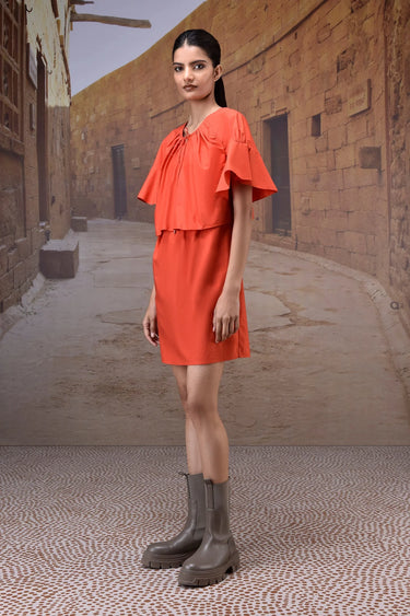 Coquelicot red dress with flounce sleeves styled for occasion and daywear