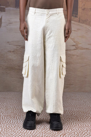 Ecru quilted cargo trousers for men by Genes Lecoanet Hemant India