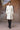 Women ecru designer overcoat with quilted texture and belted fit luxury fashion India