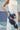 Sleeveless dress for women with abstract print and clean neckline
