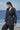 Black jacket for women with smocked design and V-neck detail