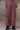 Cherry lacquer textured cargo pants for men by Genes Lecoanet Hemant India