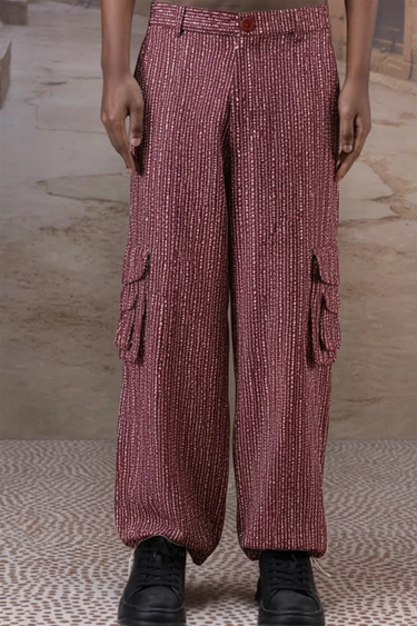 Cherry lacquer textured cargo pants for men by Genes Lecoanet Hemant India