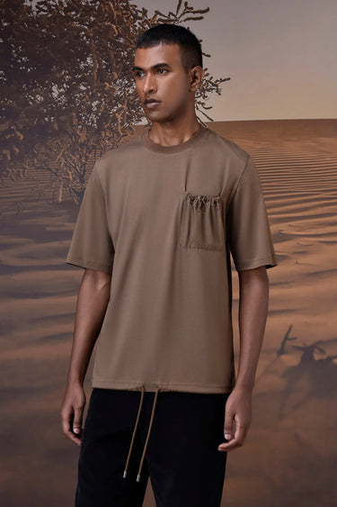 Beige T-shirt with subtle texture and chest pocket detail for casual wear
