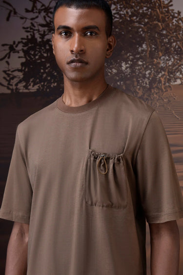 Textured beige T-shirt styled for everyday and travel wear