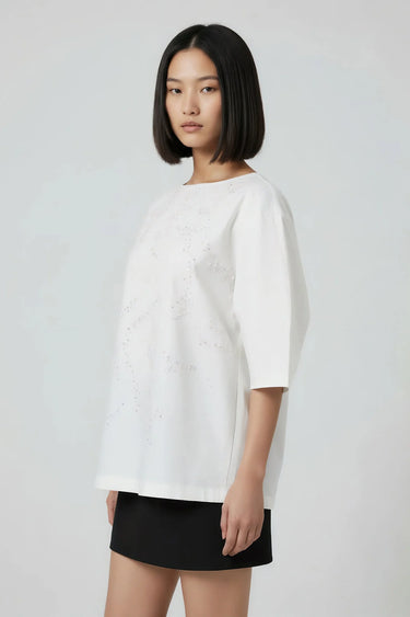 White relaxed fit top women India with embroidered detailing, modern fashion