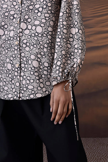 Beige cotton shirt with tie sleeve detail and fluid silhouette for modern women