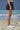 Black poly viscose skirt for women showing breathable smooth fabric texture
