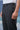 Black poly viscose trousers for men showing smooth breathable fabric texture