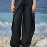 Black poly wool trousers for women with wrap-style front panel