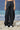 Black poly wool trousers for women with wrap-style front panel