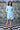 Designer striped dress with asymmetrical detailing for women