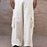 Ecru quilted cargo trousers for men by Genes Lecoanet Hemant India