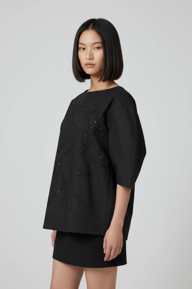 Black relaxed fit top women India with embroidered detailing, modern fashion