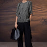 Black gathered satin blouse for women by Genes Lecoanet Hemant India
