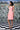 Slim fit dress with lace-up detailing in coral peach color