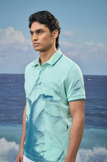 Stylish mint green polo t-shirt for men with dotted print, modern designer wear