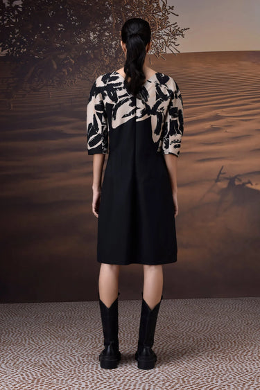 Black and white abstract print dress with structured sleeves and concealed back zip