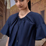 Navy cotton dress with flared flounce sleeves and relaxed silhouette