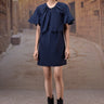 Navy cotton dress with feminine flounce sleeve detail and flowy fit