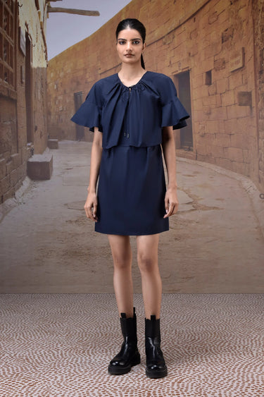 Navy cotton dress with feminine flounce sleeve detail and flowy fit