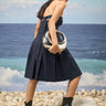 Navy pleated dress for women with fitted bodice and flowy silhouette