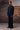Navy blue utility jumpsuit with full-length sleeves and modern workwear design