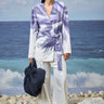White contemporary belted jacket for women with modern design