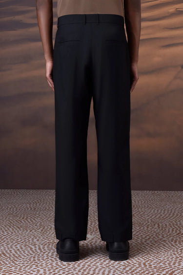 Black tailored trousers styled for formal and smart casual wear