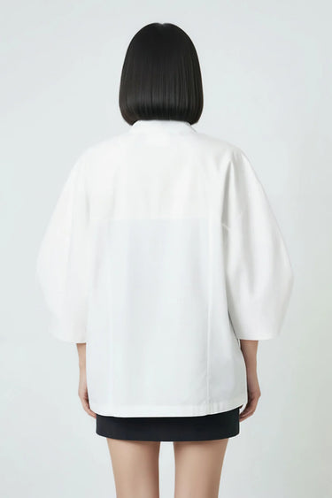 Stylish white relaxed top for women, fluid drape designer wear India