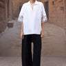 White poplin shirt with embroidered cut out sleeves for women by Genes Lecoanet Hemant India